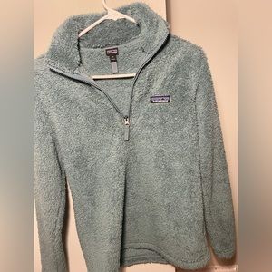 Green Patagonia sweater.